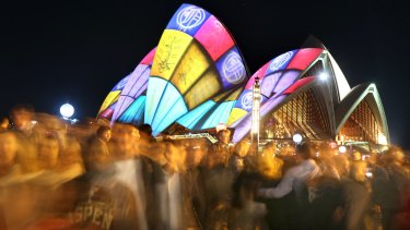 Crowds filter through the city during the 2016 Vivid Sydney Festival.