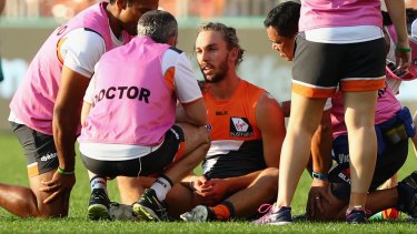 Concern: Matthew Buntine is treated by medical staff after being caught high by  Lin Jong.
