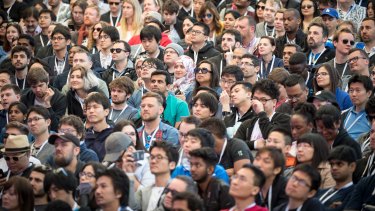 Attendees listen as Sundar Pichai, chief executive officer of Google Inc, not pictured, speaks at a developers conference in Mountain View, California, earlier this month.