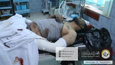 A wounded man lies in a hospital after US warplanes struck an Islamic State training camp in Sabratha, Libya.
