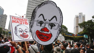 Student activists holds up a caricature of Malaysian Prime Minister Najib Razak in Kuala Lumpur in August.