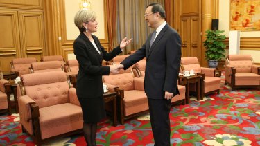 Australian Foreign Minister Julie Bishop shakes hands with Chinese State Councillor Yang Jiechi at the start of a meeting between the pair in Beijing on Thursday.