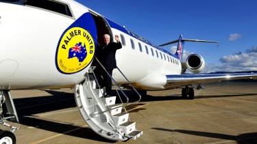 Clive Palmer boards his private jet on the campaign trail. Palmer Aviation took out a loan in 2012 to buy the Bombardier aircraft.