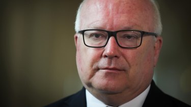 Attorney-General George Brandis will introduce new laws that crack down on foreign interference in Australian politics.