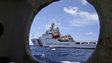 A Chinese Coast Guard ship attempts to block a Philippines government vessel in the South China Sea.