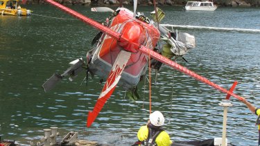 The wreckage of the seaplane is lifted from the river on January 4.