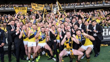 The drought has broken - Richmond celebrate their grand final win over Adelaide.