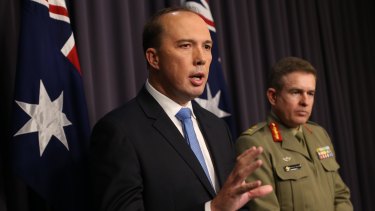 Immigration minister Peter Dutton and Major General Andrew Bottrell at Parliament House on Friday.