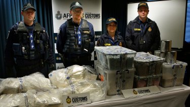 Federal Police and Customs agents with some of the Ecstasy and Cocaine after the drug bust.
