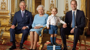 Prince George stole the show as he stands front and centre on a pile of gym blocks at a photoshoot for the Queen's 90th birthday.