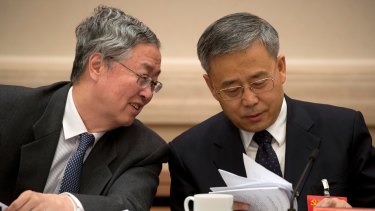 China's hardline banking regulator, Guo Shuqing, right, with Zhou, began cracking down on shadow credit in February.