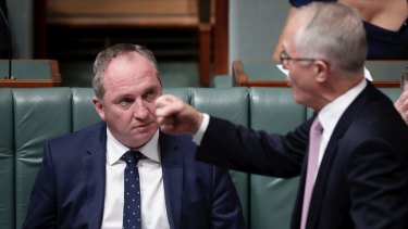 Prime Minister Malcolm Turnbull makes a point in Parliament, watched by Barnaby Joyce.