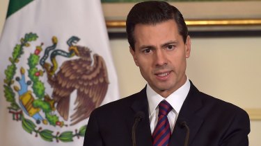Mexican President Enrique Pena Nieto addresses the media at the Mexican embassy in Paris on Sunday.