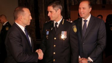 Immigration Minister Peter Dutton, with Prime Minister Tony Abbott at the swearing in ceremony of inaugural Border Force Commissioner Roman Quaedvlieg in July.