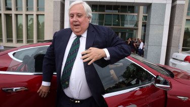 Clive Palmer arrived at Parliament House on Thursday in a Tesla electric car.