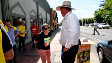 Mr Joyce is confronted by a Greens volunteer as he visits a pre-polling station in Armidale on Tuesday.