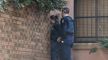 NSW police officers at the family home of Justine Damond in Freshwater, Sydney.