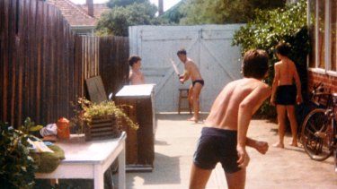 A lean Jake Niall facing left-arm bowler, brother Ben, in the '80s.