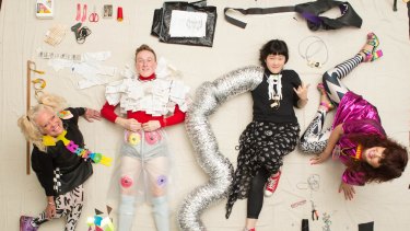 Jenny Bannister and Lia Tabrah (sitting) are teaching young people to create fashion from trash - "trashion" - seen here with Matthew Coyne and Lily Duan.