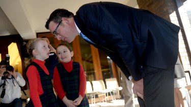 Premier Daniel Andrews sees eye-to-eye with six-year-old Frankie at St Peter's Primary School in East Bentleigh.