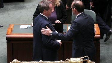 Bill Shorten and Tony Abbott in discussion after delivering statements on Malaysian Airlines flight MH17. 