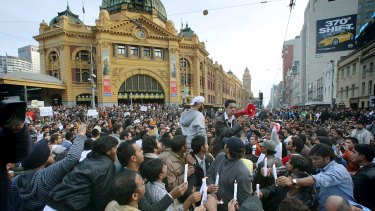A protest by thousands of Indian students in front of Flinders St  Station against a spate of student bashings in 2009. 