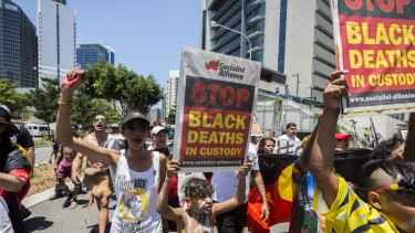 Demonstrators protest the deaths of Aborigines while in custody outside the G20 Summit in Brisbane in November last year.