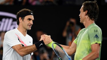 Switzerland's Roger Federer, left, is congratulated by Tomas Berdych of the Czech Republic after winning their quarter-final at the Australian Open  on Wednesday. Photo: Andy Brownbill, AP
