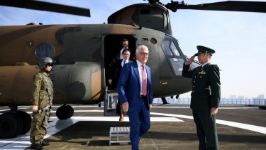 Australian Prime Minister Malcolm Turnbull disembarks a JGSDF Chinook helicopter at the Japanese Ministry of Defence in Tokyo after meeting with Japanese Prime Minister Shinzo Abe.