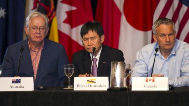 Trade Minister Andrew Robb, left, with counterparts from Brunei Lim Jock Hoi and Canada Ed Fast at the closing press conference.