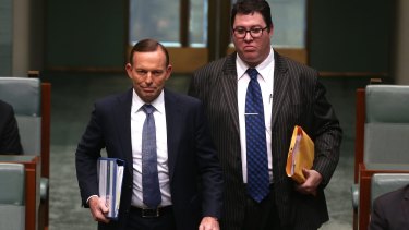 George Christensen and Tony Abbott enter Question Time together in October.