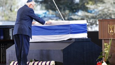 Israel's President Reuven Rivlin pays his respects.