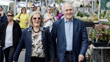 Power walkers: Lucy and Malcolm Turnbull stroll through Paddington last month.