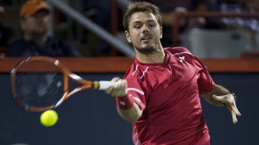 Fiery encounter: Stan Wawrinka returns to Nick Kyrgios at the Rogers Cup.