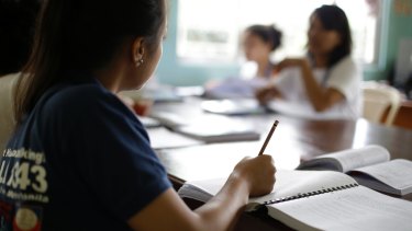 Former cybersex victims participate in a study course at a counselling centre for  survivors in Manila, the Philippines capital.
