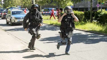 Heavily-armed police outside a movie theatre complex where an armed man has reportedly opened fire in Viernheim, Germany.
