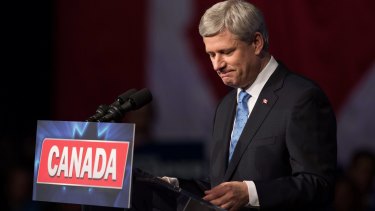 Conservative Leader Stephen Harper pauses while addressing supporters after defeat in Calgary, Alberta, on Monday.
