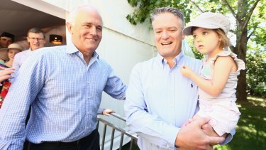 Holding fast: Malcolm Turnbull and Cormann during Family Day at The Lodge.