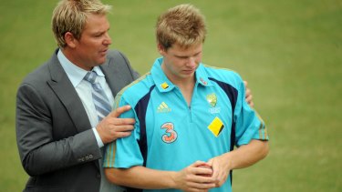 A word from the wise: Shane Warne gets in Steve Smith's ear before play on the second day of the Boxing Day Test against Pakistan in 2009.