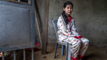 Ou Kung Panha, the daughter of jailed activist Tep Vanny inside their family home.