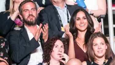 Meghan Markle sat with her friend Markus Anderson.