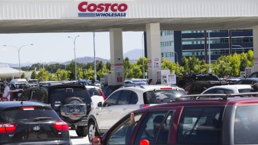 Huge lines of motorists wait to refuel at the Majura Park Costco fuel outlet on Saturday.