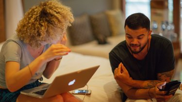 Guy Sebastian and British songwriter Fiona Bevan working on a song.