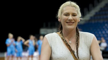 Lauren Jackson accepts a farewell gift on Friday night.