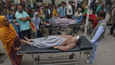 Patients outside of a government hospital after a strong tremor was felt in Jammu, India.