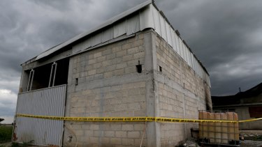 A police cordon is seen at a warehouse where a tunnel, connected to the Altiplano Federal Penitentiary and used by drug lord Joaquin 'El Chapo' Guzman to escape, ended.