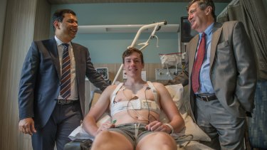 Tarran Savage with Dr Rajeev Kumar Pathak and Dr Peter French, the cardiologists who were able to reverse his condition after he went into cardiac arrest on the soccer field.