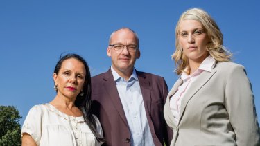 Pledge to reverse cuts to victim payouts: Sexual assault victim, Katrina Keshishian (right) with Labor MP Luke Foley and Labor MP Linda Burney at the Domain.