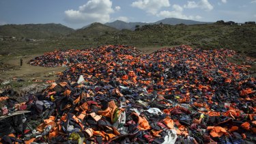 Discarded life vests litter a valley in Mithymna, Greece. 