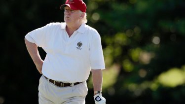 US President Donald Trump golfs in June 2012.